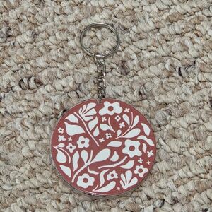 Floral Keychain with Brown and White Design